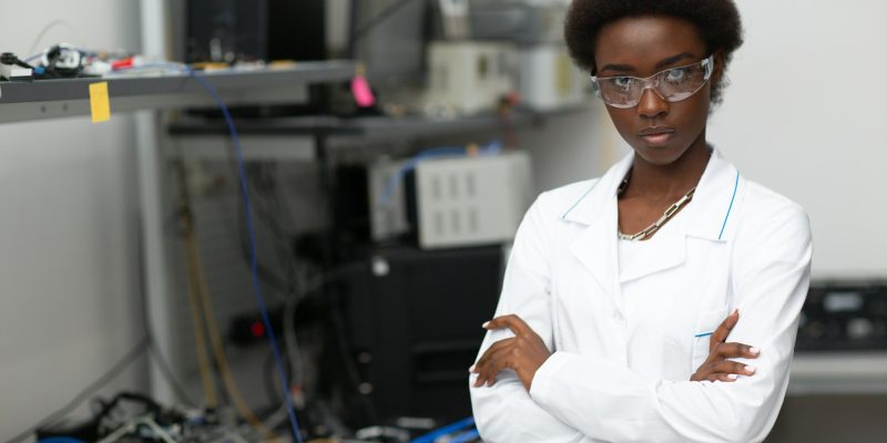 Scientist african american woman working in laboratory with electronic instruments